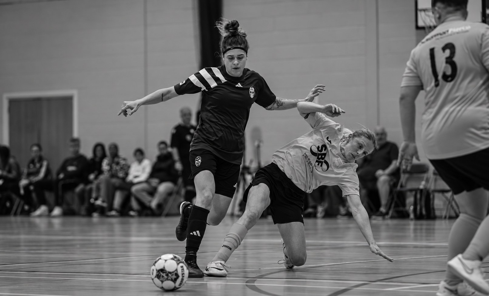 Football talent represented by East & 11th in match action